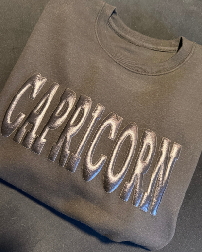 BLACK ON BLACK PUFF ZODIAC SWEATER